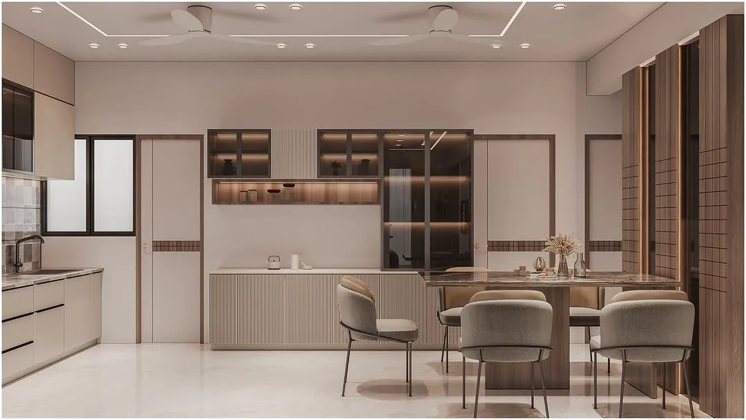 3D render of an open-plan kitchen and dining area: a stone-topped dining table with upholstered chairs beside a run of fluted cabinetry and a glazed display unit.