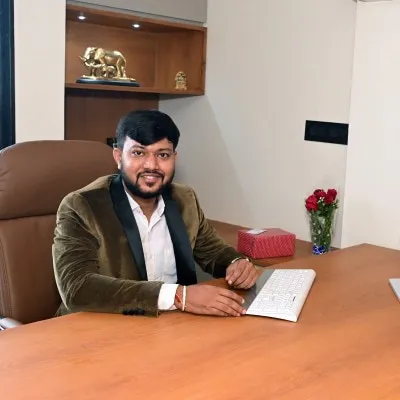 Hitarth Dave, founder and principal architect of Hitarth Dave Architects, at his desk in the Ahmedabad studio.